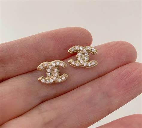 chanel 18k earrings|Chanel ring earrings.